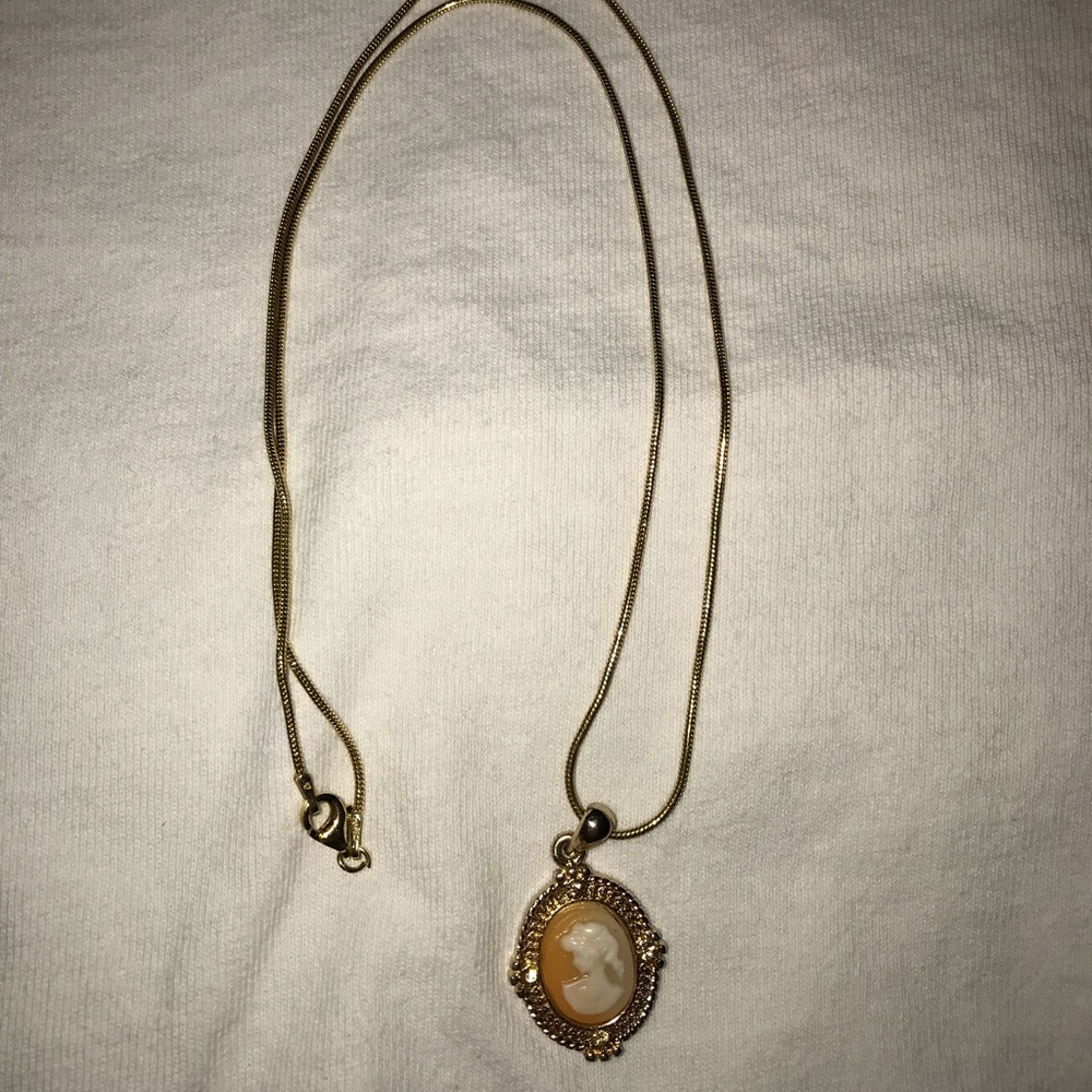 24 karat gold necklace with antique charm